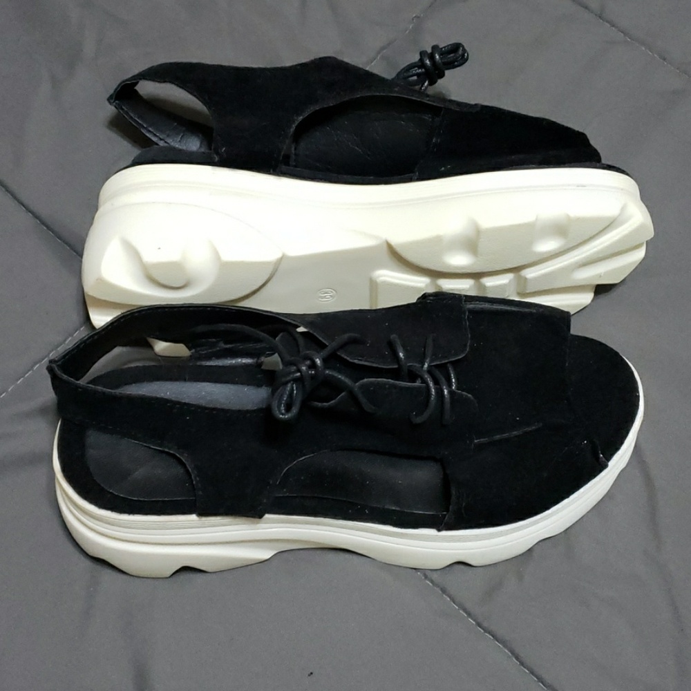 Black leather wedge shoes